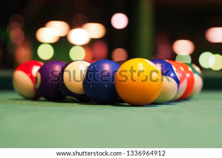billard balls on table with green fabric