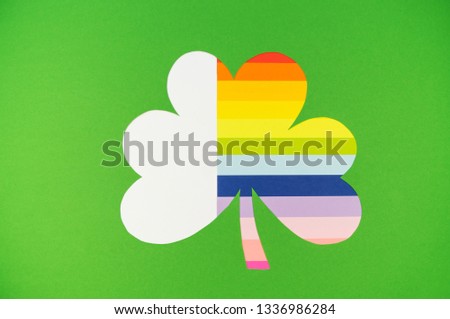 Feast day of St. Patrick. Green clover from paper. Rainbow stripes. Crafts handmade.