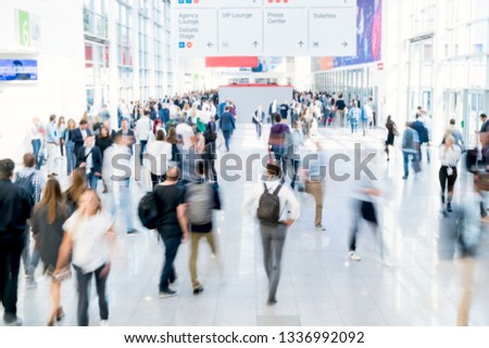 blurred people at a trade fair