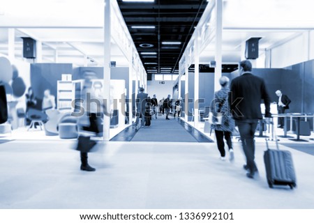 blurred people at a trade fair