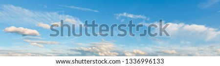 Summer evening sky panorama with fleece clouds background.