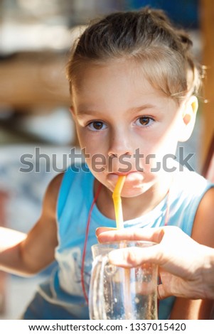 beautiful boy drinking  juice in Thailand