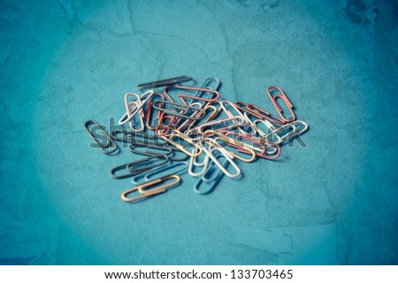 Paper clips on a blue background