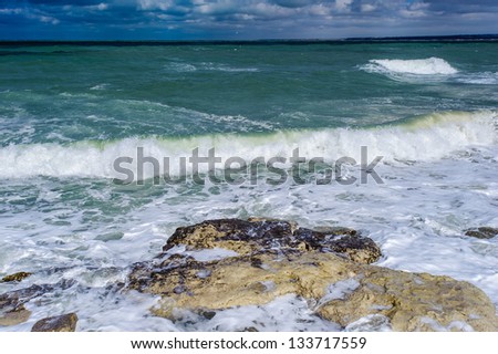 Landscape of the Black sea water crashes over the rock