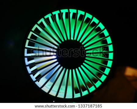 Electric fan with RGB Led Backlit in dark place.