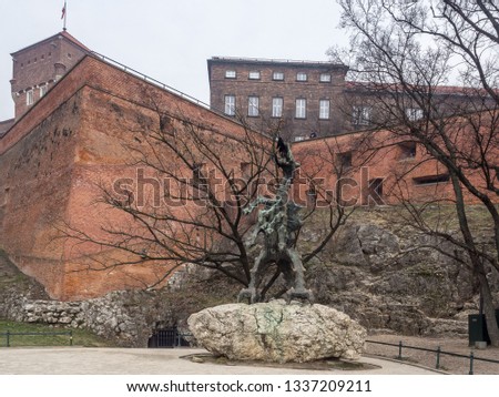 The Wawel Dragon statue close by Wawel Royal Castle in the city center of Krakow, Poland. Royalty-Free Stock Photo #1337209211