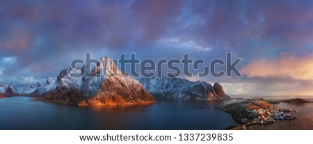 The Lofoten Islands are an archipelago in the county of Nordland, Norway. It is known for its distinctive scenery with dramatic mountains and peaks, open sea and sheltered bays, beaches, drone view