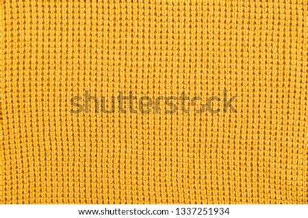 Yellow Textured Fabric with Parallel Pattern Lines


