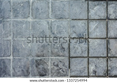 Black terracotta tile background.