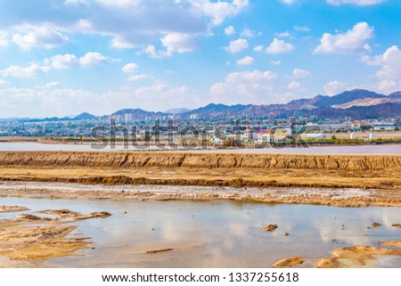 Eilat viewed behind salt pans, Israel