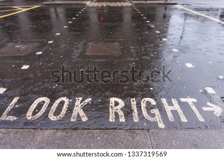 Look right sign on street pavement in London City