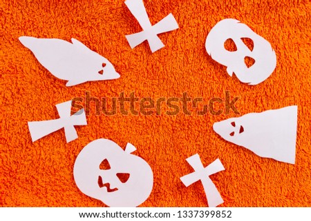 halloween concept image. . graveyard made from paper. blue background