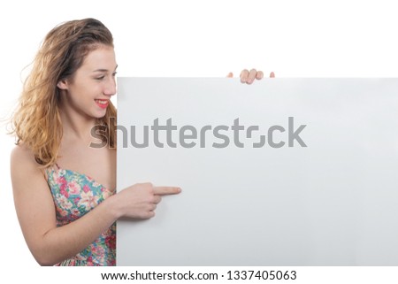 happy smiling young woman showing an empty blank signboard with copyspace