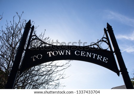 Hartlepool / Great Britain - March 11, 2019: To Town Centre urban sign in decorative metal with tree and sky background