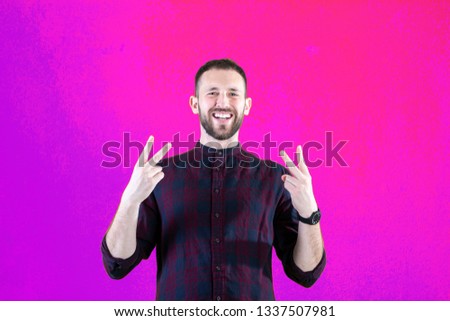 Guy making ok and victory sign
