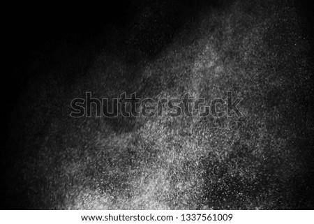white powder color spreading effect for makeup artist or graphic design in black background 