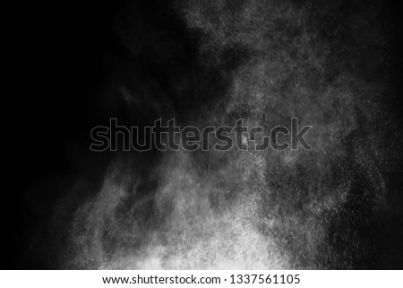 white powder color spreading effect for makeup artist or graphic design in black background 