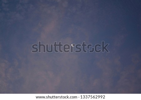 Afternoon sky with cloud and little moon                     