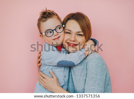 Tender feelings between mom and  son with Down syndrome. She is my precious treasure Royalty-Free Stock Photo #1337571356