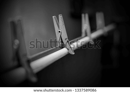 Clothespins in the photo the rack holds the background paper in black. Stock aluminum photo.