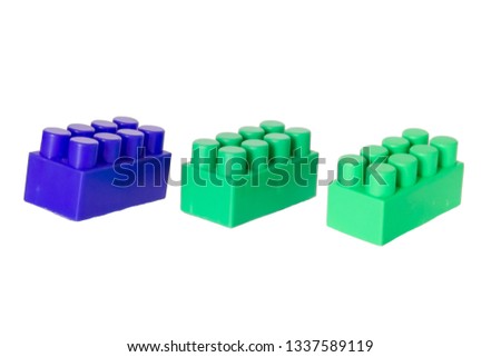 pictured in the photo details of a children's plastic constructor on a white background. colored cubes. block.