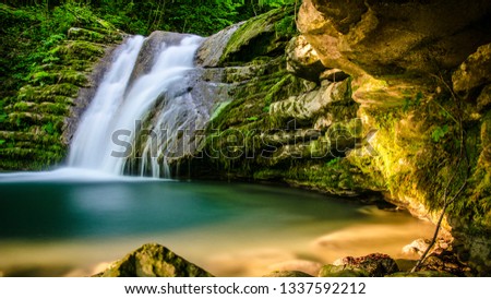 waterfall and long exposure in forest Royalty-Free Stock Photo #1337592212