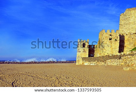 castle on the beach and sea Royalty-Free Stock Photo #1337593505