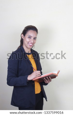 Portrait of confident Indian businesswoman against white background - Image