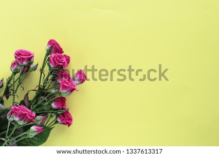 small wedding roses bouquet on yellow background