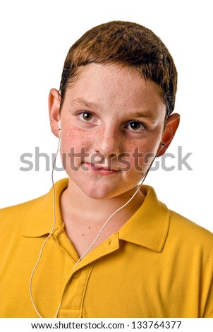 Young boy listening to mp3 player