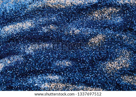 blue texture with small sparkles and light waves