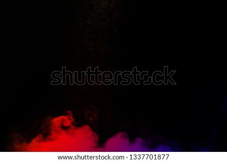 Multi-color powder explosion on black background