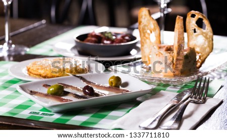 Image of set of variety dishes on the table in restaurant.