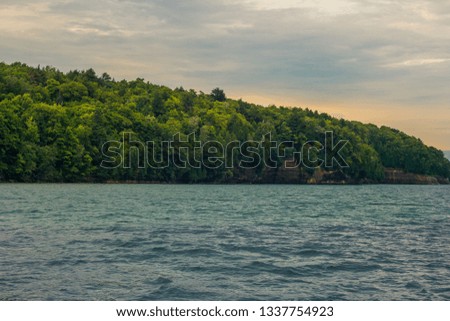 Beautiful Scenic lanscape with blue water and green mountain