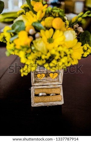 Charming wedding rings in a wooden box