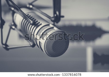 Professional microphone and sound wave form Royalty-Free Stock Photo #1337816078