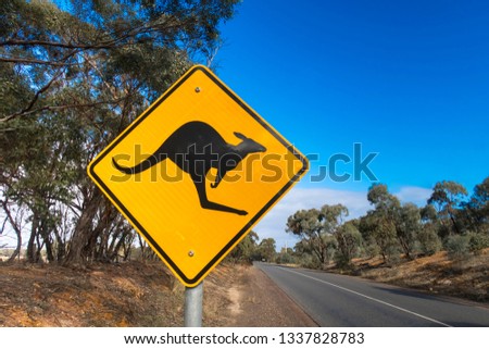 Kangaroo crossing  sign on the side of an australian road
