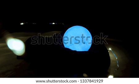 Blue moon that shine or bright in the darkness that has light around it with bleary background 