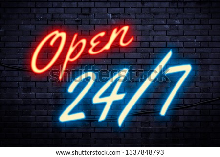 Service open any time and every day or operating nonstop concept theme with a red and blue light neon sign against a brick wall with the text Open 24/7