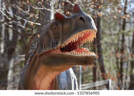 Portrait of dinosaur on nature background