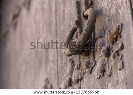 Old wooden door with iron knocker.