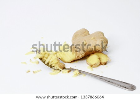 ginger on a table with spoon no people on white background stock photo