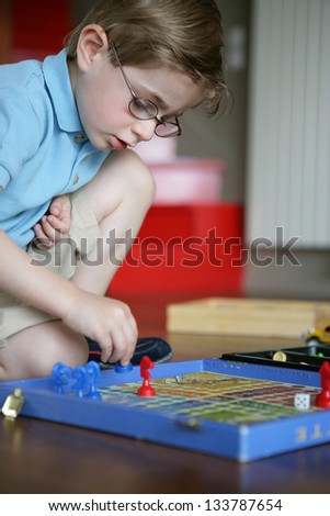 little boy playing alone