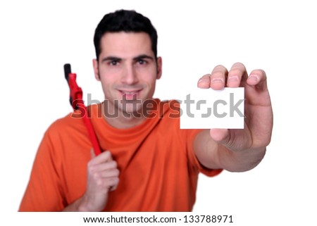 Builder with wrench holding business card