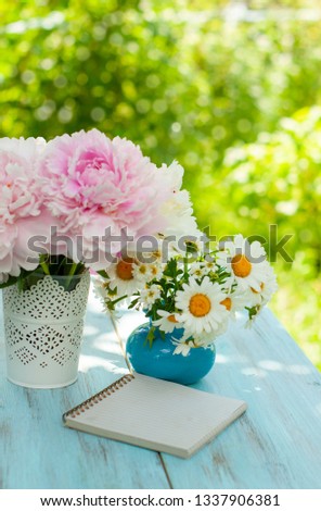 Bouquet of pink peonies and daisies, greeting card or summer calendar