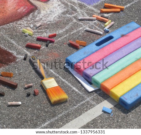 Street painter's work tools, pavement street artist  painting over the asphalt in Madonnari competition of chalk paintings, at  Santuario della Beata Vergine delle Grazie.