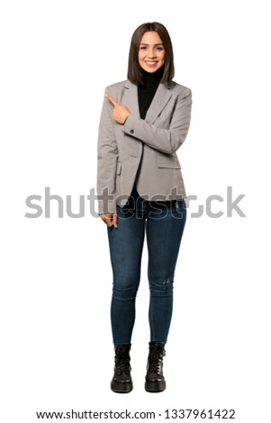 A full-length shot of a Young business woman pointing to the side to present a product over isolated white background