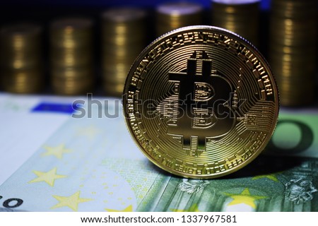 Coin physical golden Bitcoin BTC on green banknote, background from golden coins.