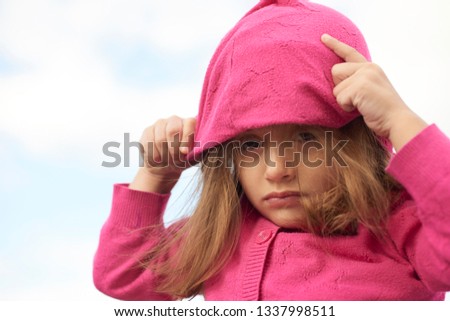 Portrait of a little girl in a park