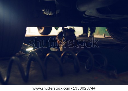 Repairing car wheels at the workshop garage low angle view